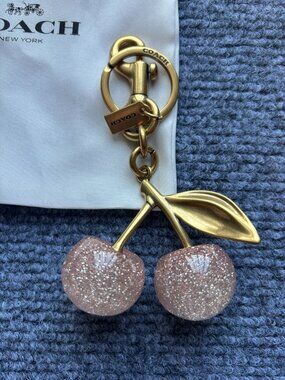 COACH Pink Glitter Cherry Bag Charm with Gold Hardware